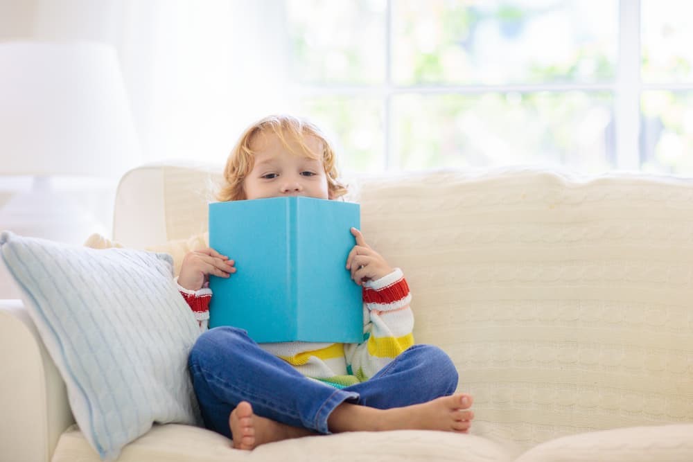 toddler with book